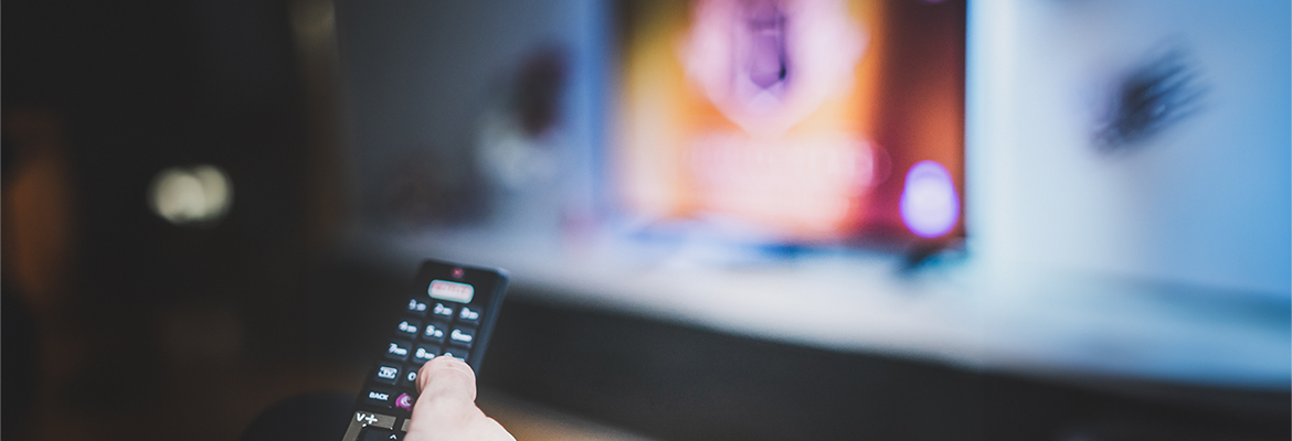 remote control pointing to a TV screen