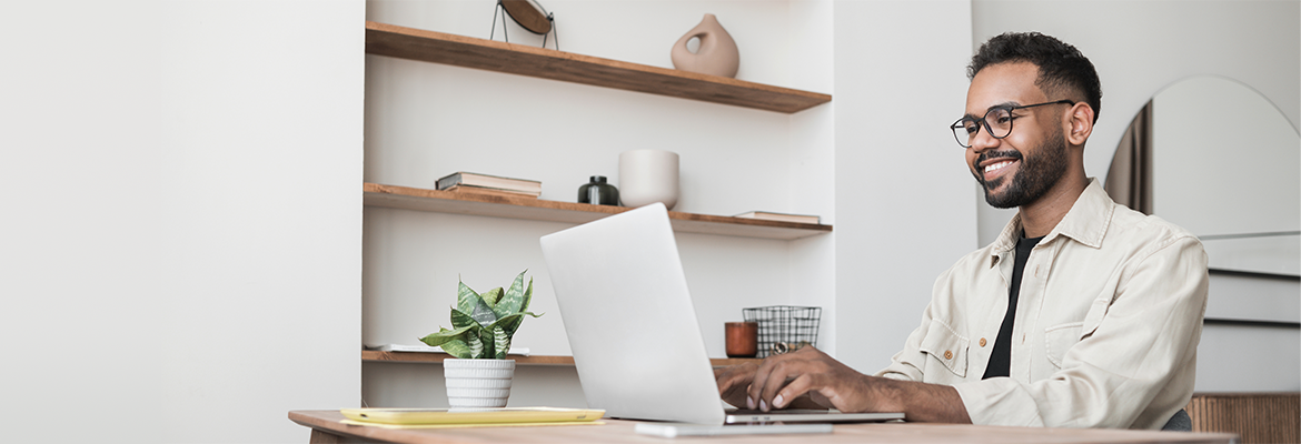 Image of person looking at computer screen, supporting FreeWheel Insights: Your Questions on the State of Identity, Answered