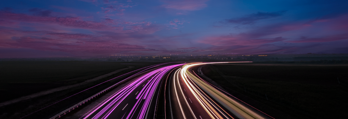 Image of purple lights on a road at night, supporting FreeWheel Insights: Why Nearly Two-Thirds of Video Advertisers are Prioritizing Supply Path Optimization
