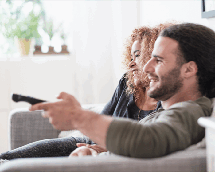 Man and women watching TV