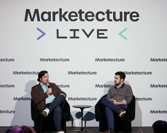 Speakers on stage at event