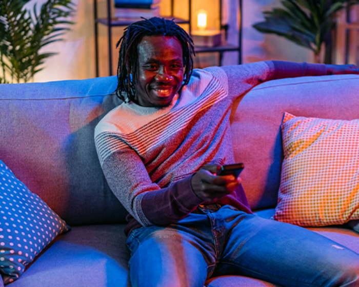 Man watching tv on couch