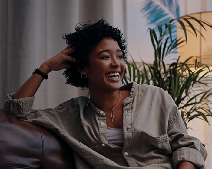 Woman watching TV on the couch