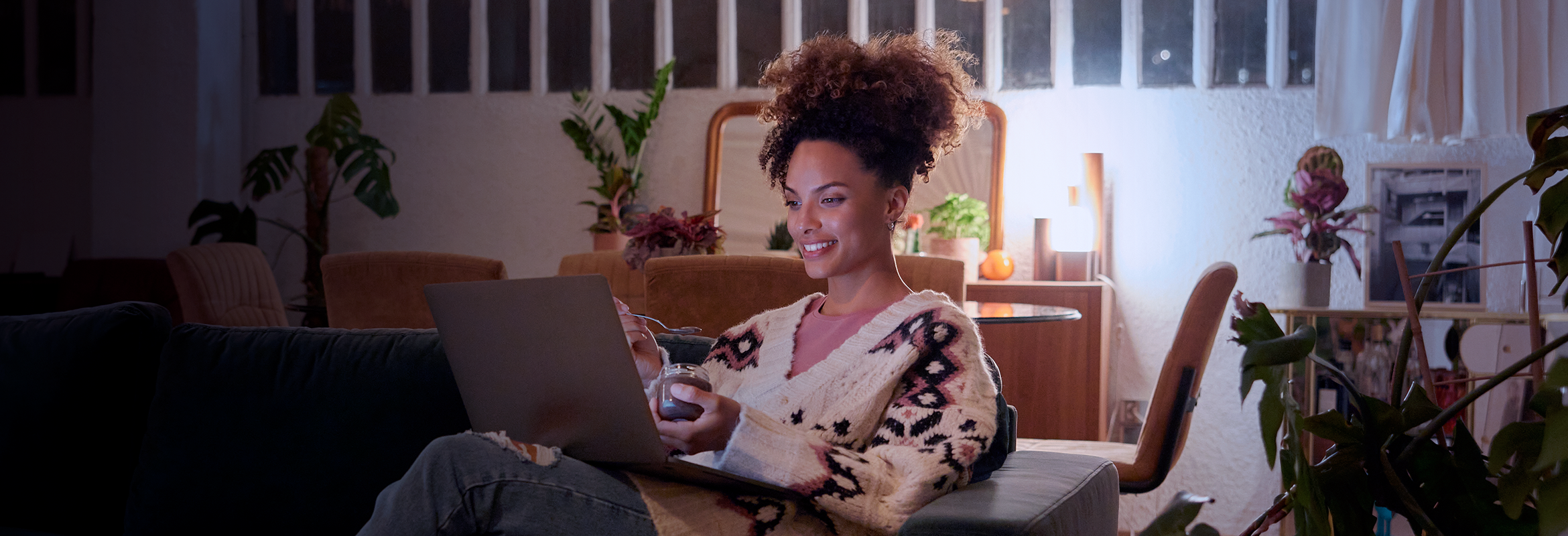 Woman watching a streaming show on a laptop