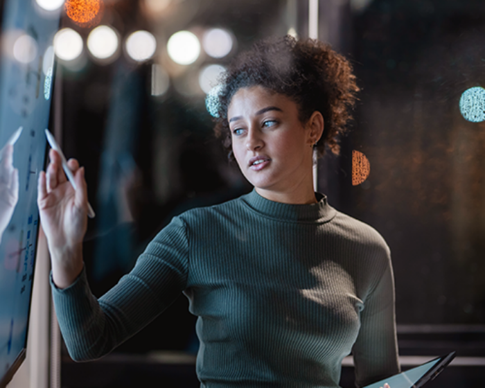 Woman presenting data in an office